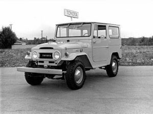 A black and white photo of an old toyota truck.