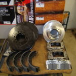 A table with brake parts and other items.