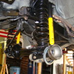 A car suspension with springs and shock absorbers.