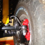 A close up of the front tire on a vehicle.