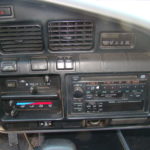 A car dashboard with many different items on it
