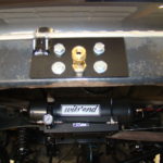 A close up of the front suspension on a vehicle