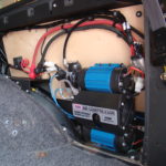 A close up of the electrical wiring on an electric vehicle.