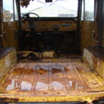 A truck that has been stripped of its interior.