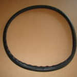 A black rubber ring on top of a table.