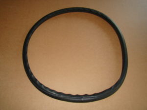 A black rubber ring on top of a table.