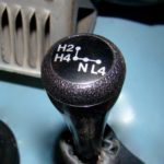 A close up of the shift knob on an automobile.