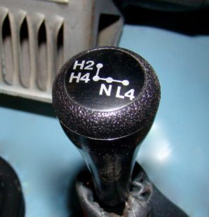 A close up of the shift knob on an automobile.