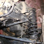 A car that has been damaged by the suspension system.
